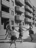 Children Playing in Front of New Apartments Being Built in Bombed Out Areas