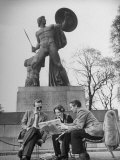 Britons Relaxing in Hyde Park on a Sunny Afternoon under a Statue