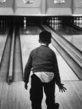Child Bowling at a Local Bowling Alley