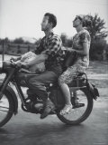 Man and Woman Riding on Motorcycle