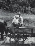 Man and Woman Sharing Cask of Liquor