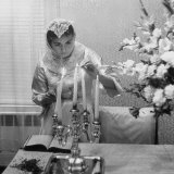 Woman Lighting Candles During Hasidic Jewish Wedding Ceremony