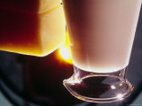 Pitcher of Cream and Block of Parmesan Cheese Are Ready to Be Used in Fettuccine Alfredo
