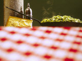 Skillet of Fettuccine Alfredo Sits Next to a Block of Parmesan Cheese and a Grater