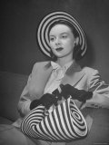 Model Michele Fallon Wearing John Frederics Striped Straw Hat with Matching Handbag