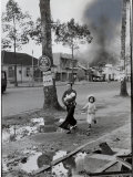 Vietnamese Mother and Children Fleeing Down City Street During Brief Violent Binh Xuyen Uprising