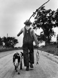 Young Boy and His Dog Walking Home from Fishing