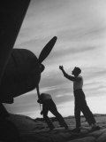 US Marines Pushing Through the Props of Bomber at US Naval Base on Midway Island