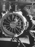 Welder with an Acetylene Torch Cutting Through Some of the Old Tubes in a Modern Locomotive