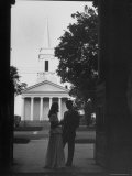 Two Friends Sharing Quiet Moment in Front of Chapel at End of Graduation at Monticello College