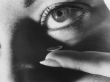Woman Preparing to Insert Contact Lens Into Her Eye