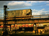 Buy Moody Sunlight Showing Hopper Car of the Reading Railroad Idle on Rusting Elevated Span at AllPosters.com