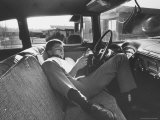Teenager Robert Riesenmy Jr. Reading in Car at Home