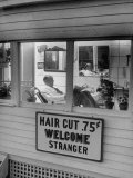 Man Waiting in a Barber Shop For a Haircut