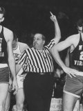 Referee Jim Enright Calling Plays and Using Hand Signals During a Game
