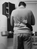 Warren Kemmerling and Wife Jo Ann Sharing Close Moment in Kitchen of Their Small Apartment