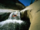 Buy Suspended in Mid-Air, a Kayaker Sails Down a Short Waterfall and is Headed for White Water Below at AllPosters.com