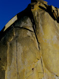 A Rock Climber Climbs a Rock Face Without the Aid of Hooks or Ropes in Needles, California