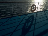 Life Preserver Hanging on a Railing of a Cruise Ship Deck