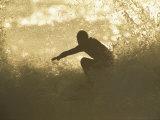 A Surfer Surrounded by the Spray of a Breaking Wave