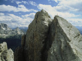 Buy A Climber Standing at the Top of a Mountain in the Dolomites, Italy at AllPosters.com