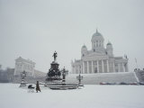 A Woman Walks in Senate Square, Passing Lutheran Cathedral