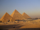 A Man on a Donkey in the Desert Near the Great Pyramids of Giza