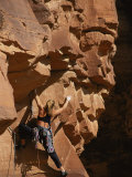 Buy A Woman Climbs Sandstone Cracks in Utah at AllPosters.com