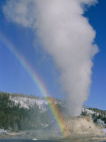 A Rainbow Forms During an Eruption of Castle Geyser