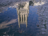 A Puddle Reflects the Central Tower of the Majestic Washington National Cathedral