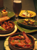 Several Dishes of Tapas and a Beer in a Spanish Restaurant