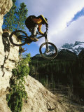 Buy Man Jumping on His Mountain Bike with Ha Ling Peak in the Background at AllPosters.com