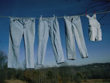 Four Pairs of Jeans Hanging on a Clothesline