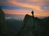 A Silhouetted Climber Watches the Sun Set over the Karakoram Mountains