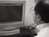 An Accountant Stares at a Computer Screen