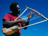 Man Playing Local Stringed Instrument at Kebirigo, Kenya
