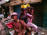 Group on Rickshaw Celebrating Holi Festival, Delhi, India