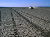 Buy Four-Wheel Drive Vehicle Crossing Desert Plain, Grand Bara, Djibouti at AllPosters.com