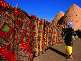 Buy Bedouin Girl Hanging the Laundry Outside Mud-Built "Beehive" Houses, as Srouj, Syria at AllPosters.com