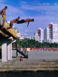 Boys Jumping from Bridge in El Rodadero, Seaside Suburb of Santa Marta, Colombia
