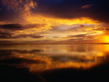 Buy The Setting Sun Casts Light on Dark Clouds and Sea, Cook Islands at AllPosters.com