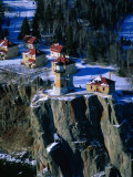 Lighthouse and Houses Under Blanket of Snow on Top of Cliff at Split Rock, Minnesota, USA