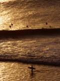 Surfers Riding Waves on the Bukit Badung Peninsula, Bali, Indonesia