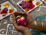 A Hindu Woman Worshipper Holding Rose Offering at the Sri Srinivasa Permual Temple, Singapore