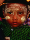 Buy Boy with Paste of Thanakha Tree Bark on Face, Looking at Camera, Myanmar (Burma) at AllPosters.com