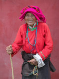 Elderly Tibetan Woman with Red Wall, Tagong, Sichuan, China