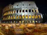 Runners Make Their Way Past the Colosseum in Rome