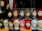 Buy Arab Woman Buys an Islamic Head Dress in Preparation for the Muslim Holy Fasting Month of Ramadan at AllPosters.com