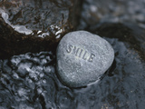 Rock with the Word Smile in Rushing Water