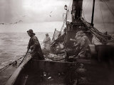 The Crew of a Yarmouth Herring Boat Pull in Their Catch on a Storm Tossed North Sea, 1935